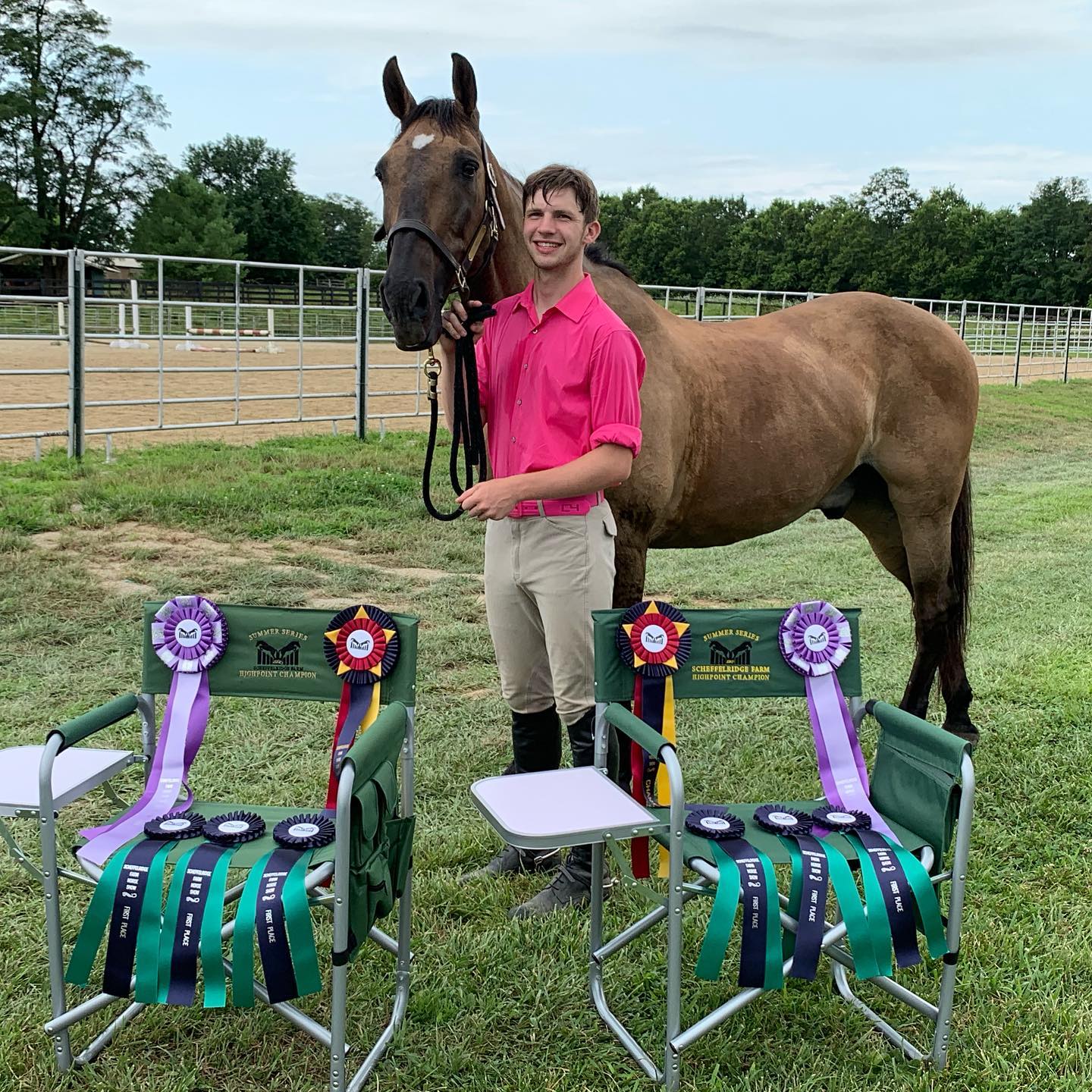 Kaleb beside a buckskin with Scheffelridge Farm Highpoint Champion chairs full of ribbons.