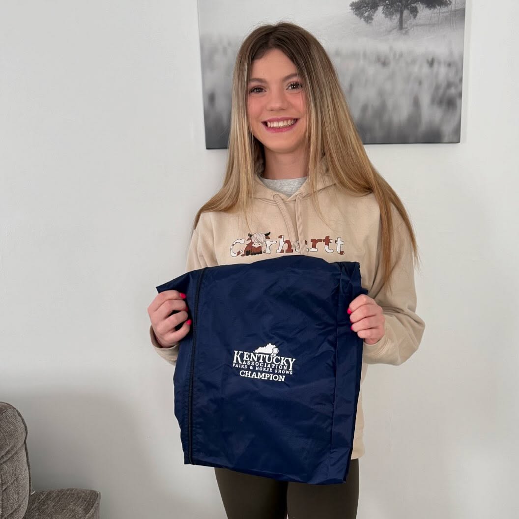 Rylee with the Kentucky Association of Fairs and Horse Shows Champion jacket prize.
