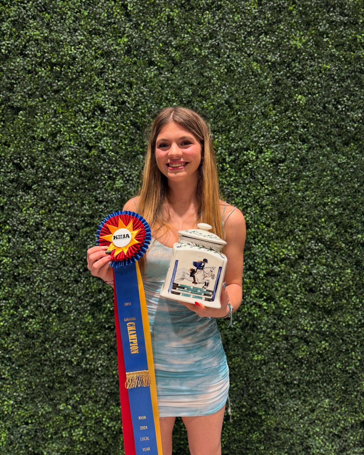 The KHJA 2024 Grand Champion ribbon with a painted trophy jar.