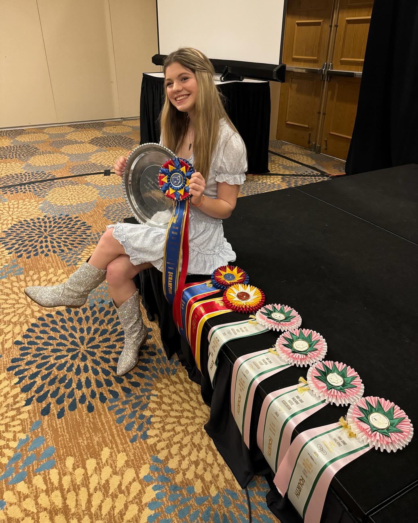 Rylee with the Mid-Ohio Walking Horse youth high-point trophy tray and a run of ribbons at the banquet.