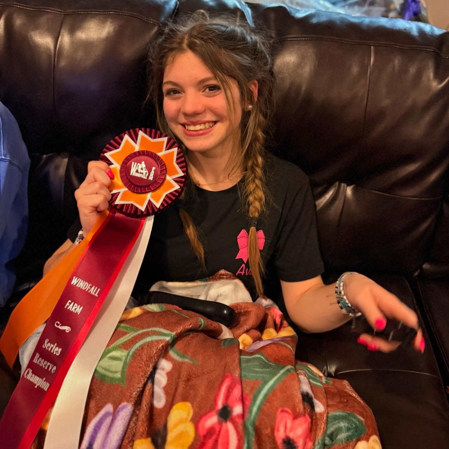 Rylee with the Windfall Farm Series Reserve Champion rosette.